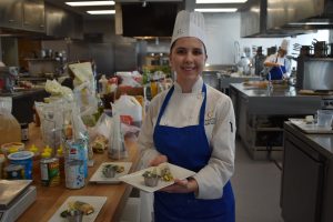 Participant presenting her dish