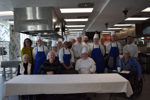 Group photo of the cooking competition judges and participants